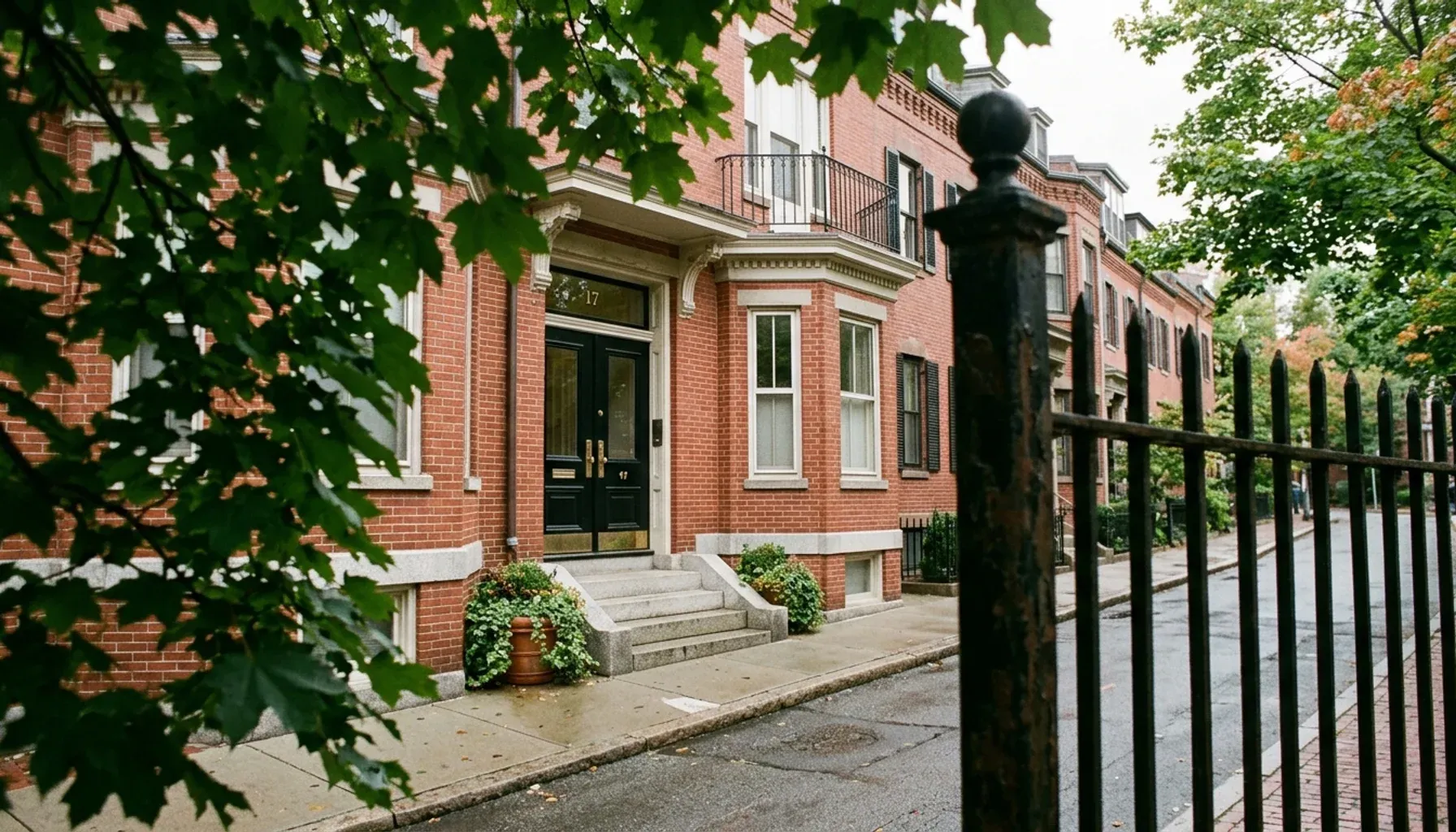 Brick rowhouse on a leafy Cambridge, MA street, representing the best property management company in Cambridge