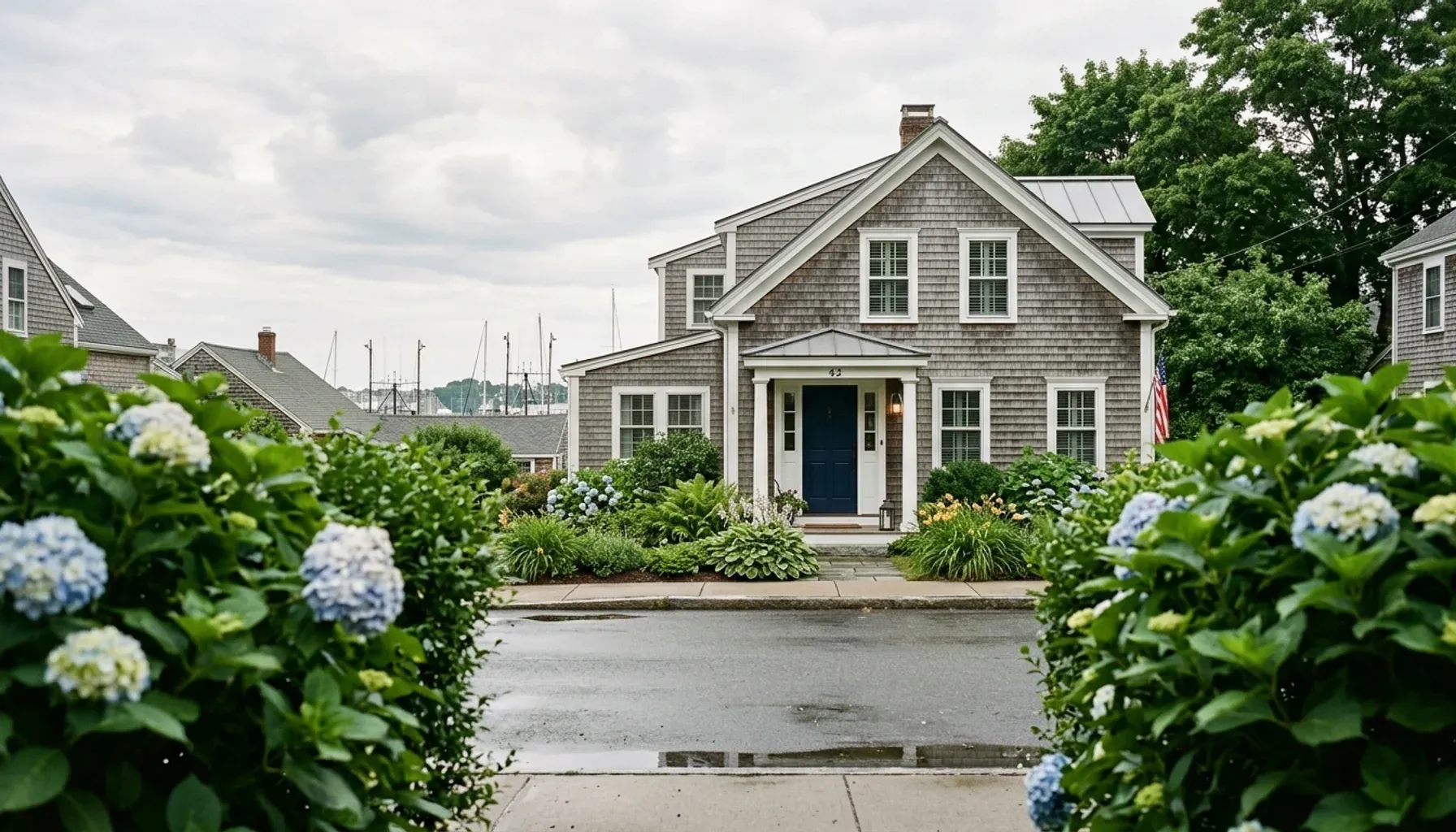 Gray-shingled Gloucester, MA house with a white-trimmed porch, a home owner could rent out after completing key steps
