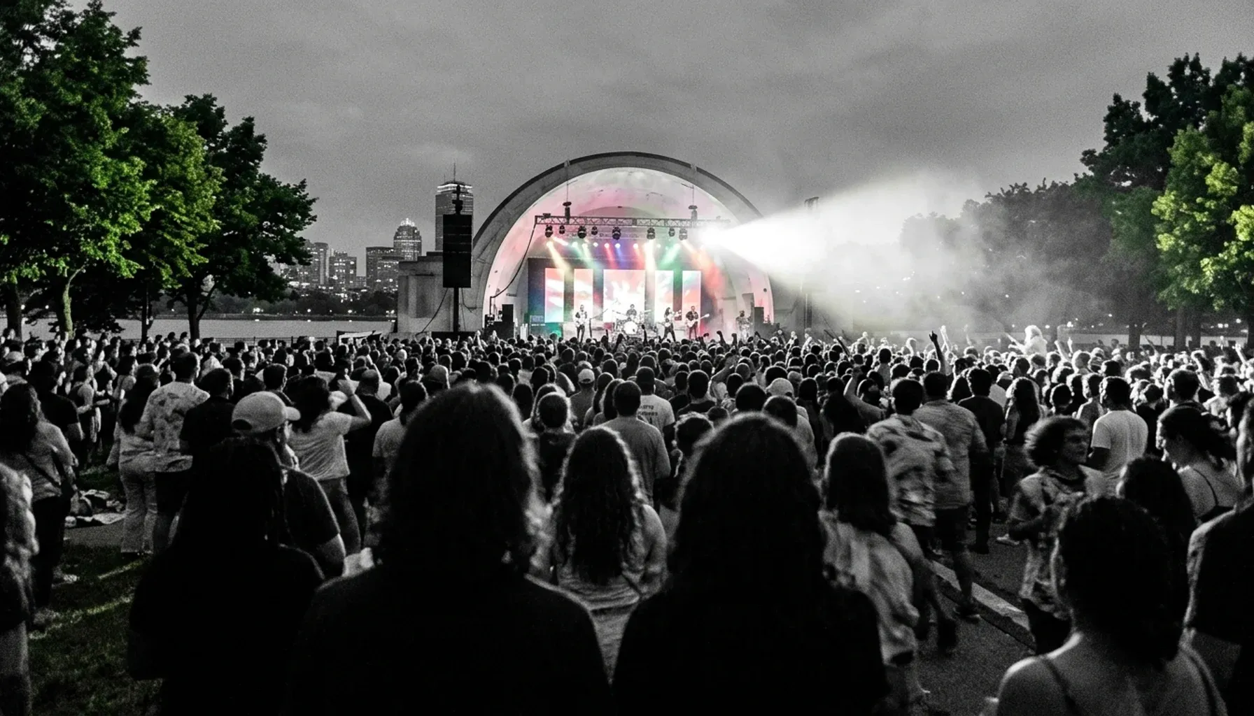 Crowd silhouettes at a Hatch Shell concert, one of the fun things to do at Boston's Charles River Esplanade