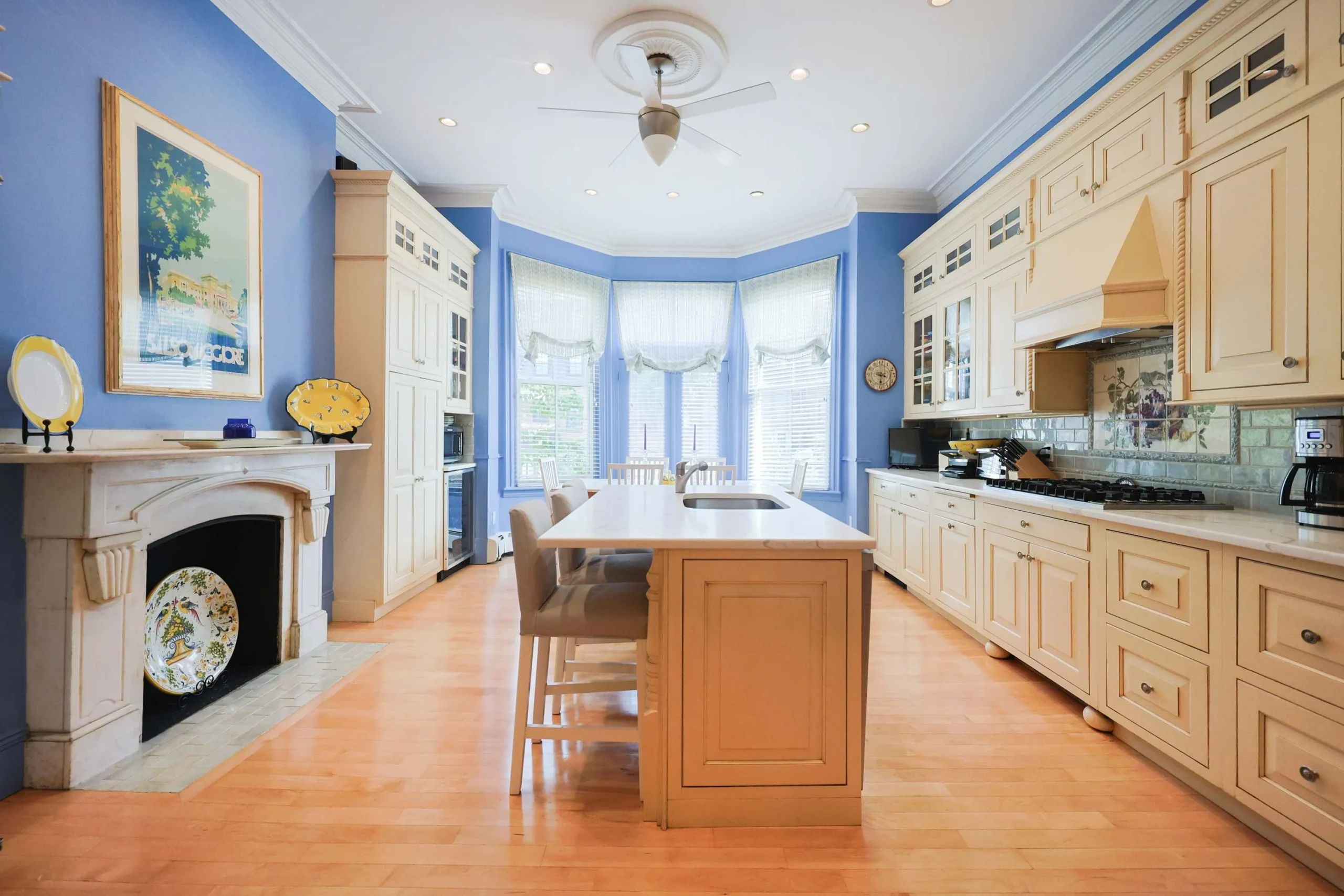 Brownstone kitchen with island seating, ideal for a large group vacation home rental in Boston