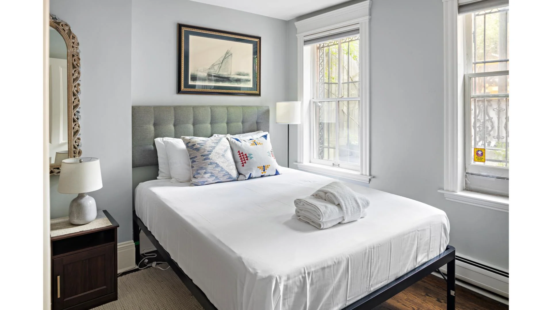 Coastal-inspired bedroom with patio access in Boston weekend getaway rental
