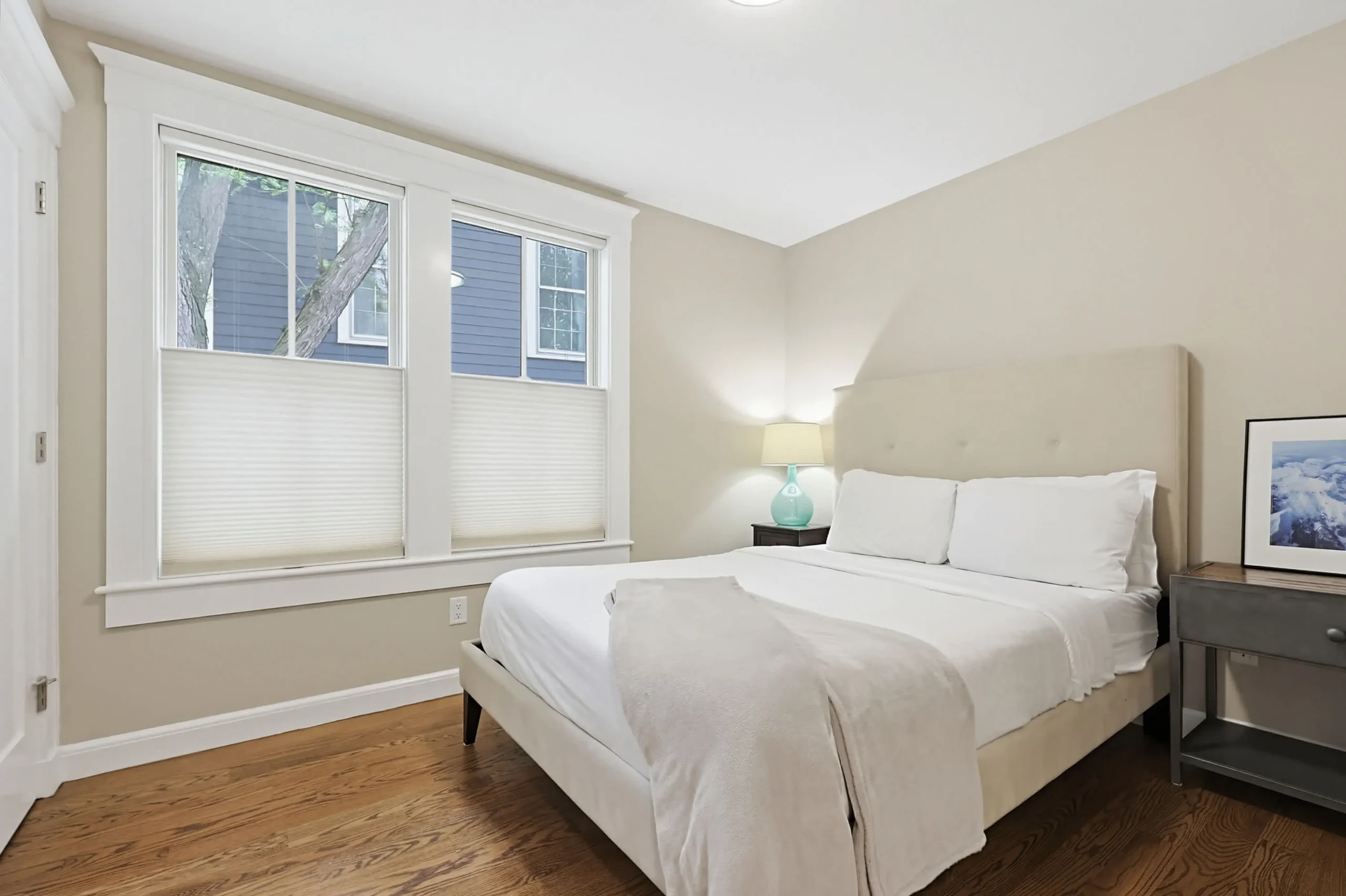 Bright queen bedroom in a Cambridge apartment for a romantic getaway